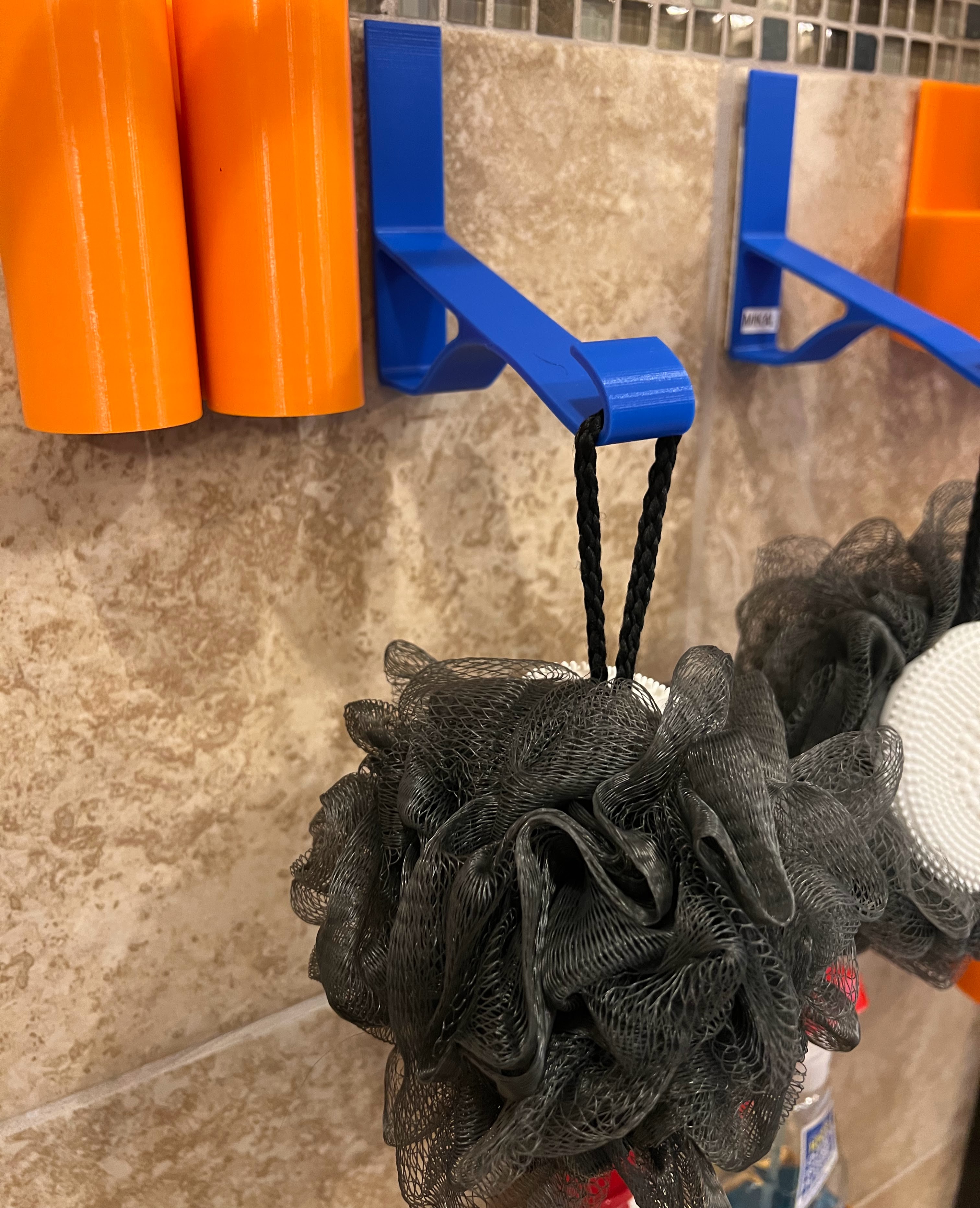 Photograph of functional 3D printed loofah shower wall hanger